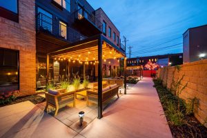 Hotel Crosby's courtyard lit up at night.