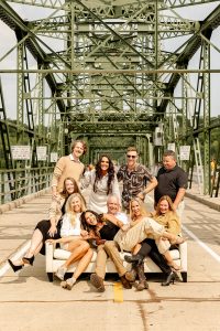 A corporate group posing in front of the lift bridge during a corporate retreat in Stillwater. 