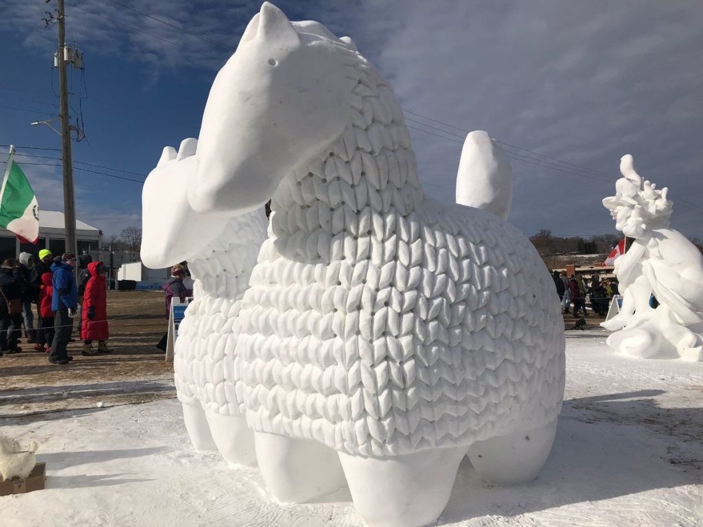 Snow sculpture of two horses. 