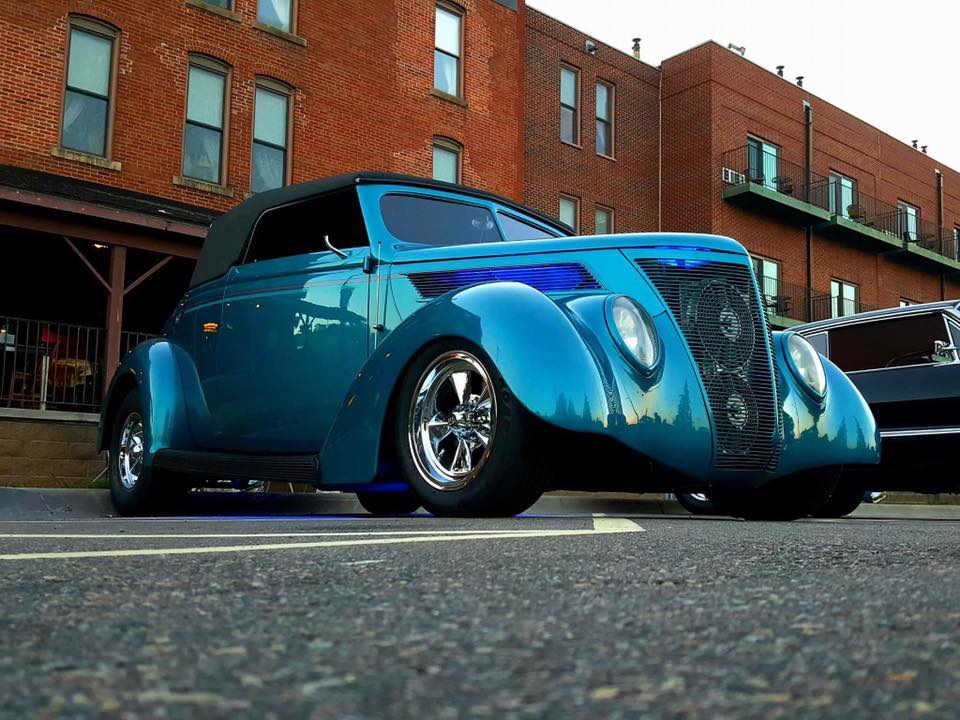 low angle photo of a blue retro car