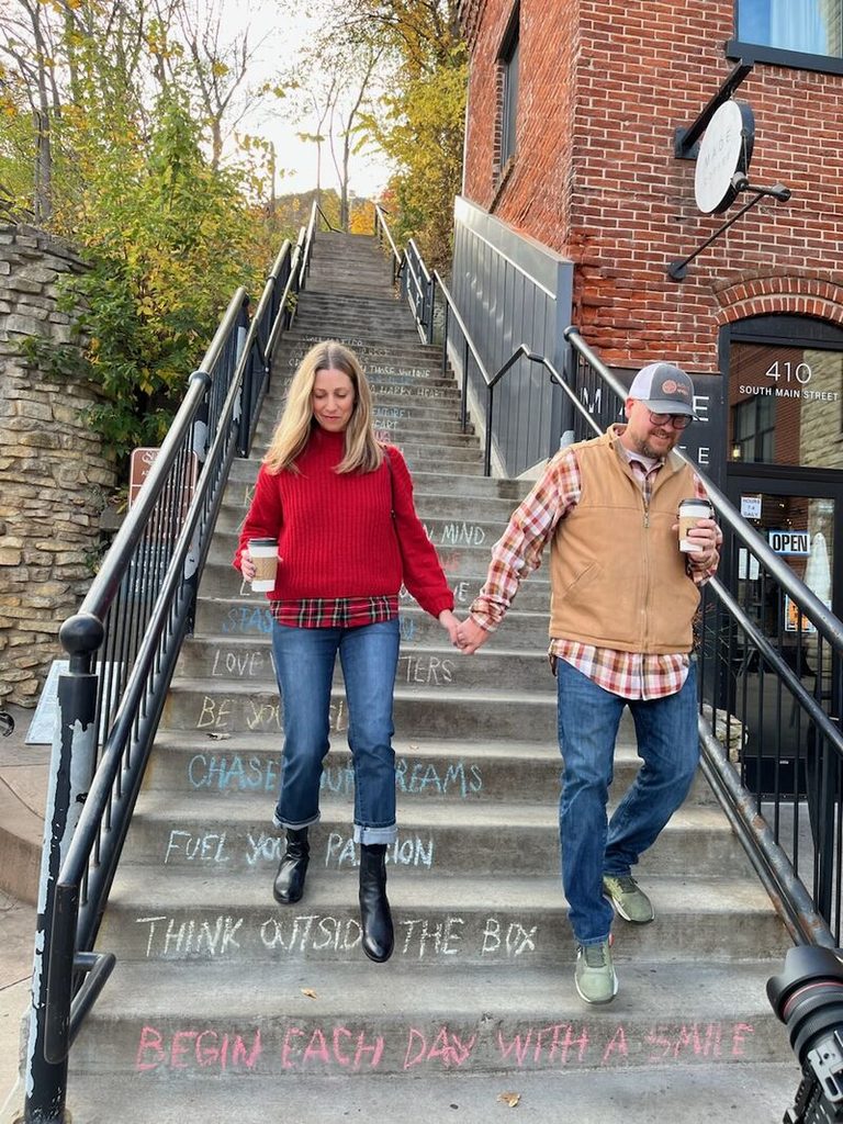 Couple on stairs in fall