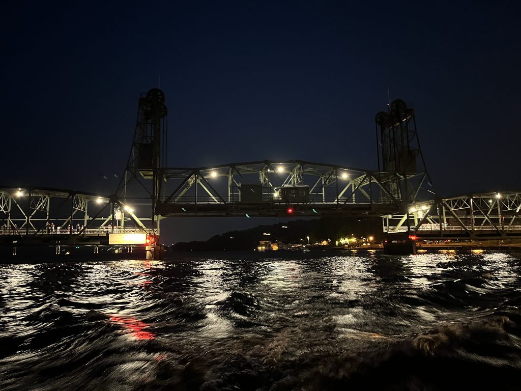 Rough waters in front of the lift bridge at night Chelsea Archer