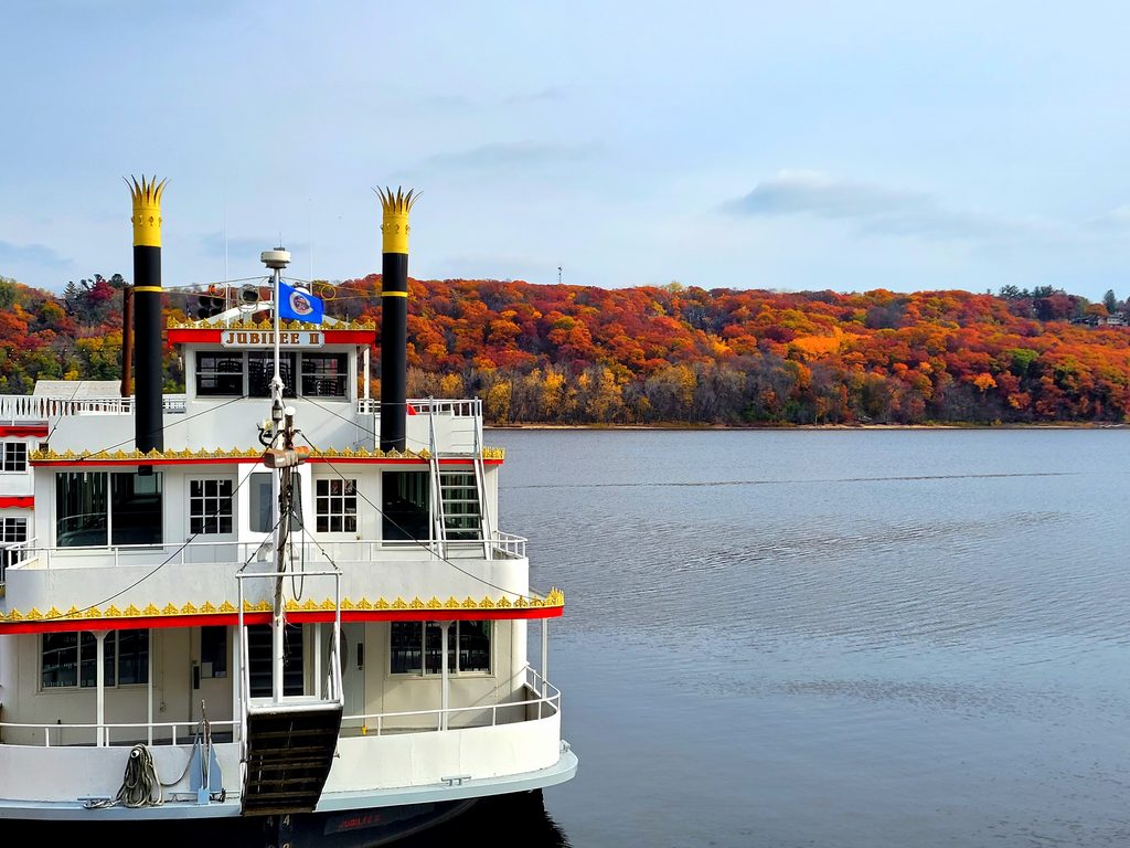 back of the riverboat setting sail on a fall day Laura Garske